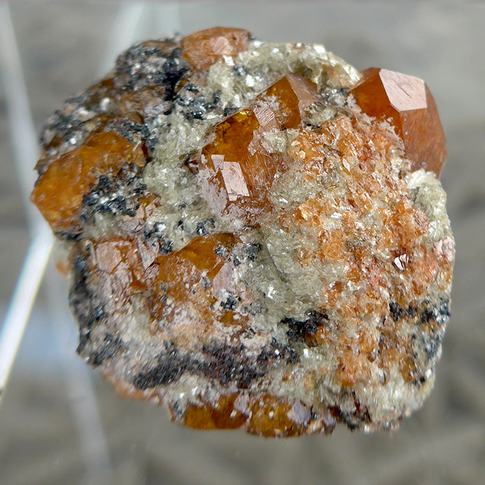 Small Orange Spessartine Garnets on Matrix