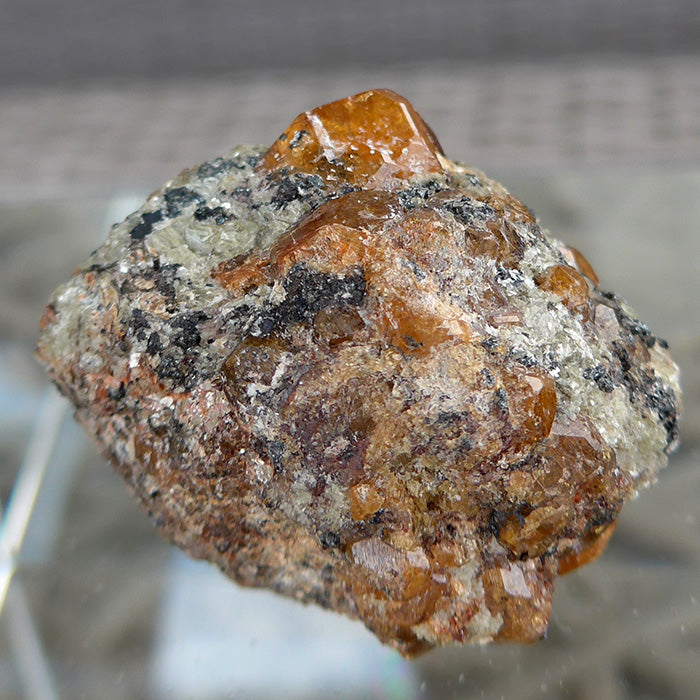 Small Orange Spessartine Garnets on Matrix